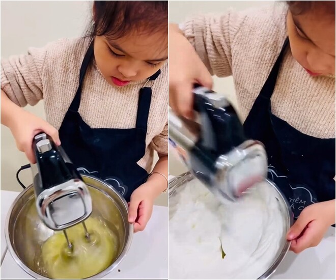 Cô bé sử dụng máy đánh trứng để đánh bông lòng trắng một cách chuyên nghiệp.